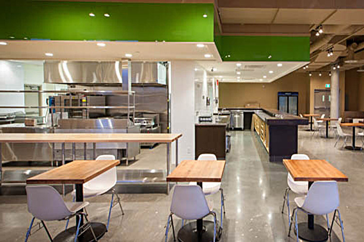 Fortius Sport & Health Cafeteria Kitchen, counters, storage, and furniture by Paramount Projects General Contractors of Vancouver