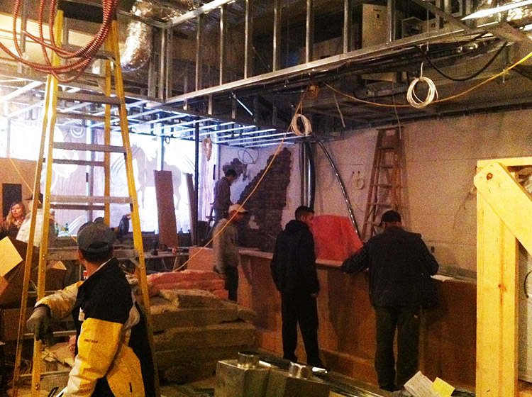 Framing, insulation and faux brick walls at Patron Tacos & Cantina by Paramount Projects General Contractors